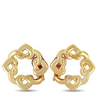 Bvlgari Doppio Cuore 18K Yellow Gold Earrings: The Bvlgari Doppio Cuore earrings are made of 18K yellow gold and each of the two weighs 9.45 grams. They measure 1.12 in length and 1.12 in width. The pair is offered in estate condition and