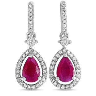 14K Wg Diamond and Ruby Pear Stud Earrings: These earrings are crafted from 14K white gold and set with two rubies that amount to 0.84 carats and with a total of 0.17 carats of diamonds. The earrings measure 0.75 in length and 0.25 in width,