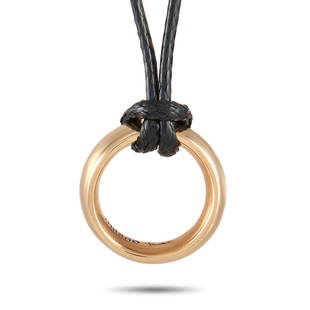 Pomellato Milano 18K RG Circle Pendant Necklace: This classy Pomellato Milano 18K Rose Gold Circle Pendant Necklace is sleek and simple. The necklace is made with a black cord measuring 24 inches and features a smooth hollow circle pendant made