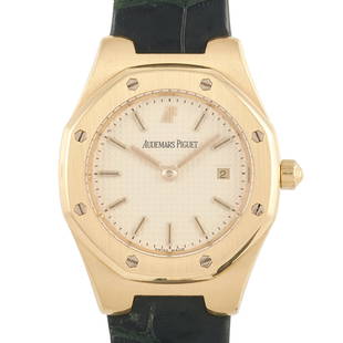 Audemars Piguet Vintage Lady Royal Oak Women's Watch: A lady's watch with a timeless appeal, the Audemars Piguet Vintage Lady Royal Oak Women's Watch features a solid 18K yellow gold case in brushed finish. Present is the iconic hexagonal bezel secured b