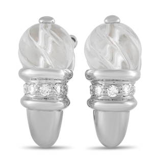 Boucheron 18K WG Diamond Clip On Earrings: Theres something impeccable about these dynamic Boucheron Earrings. Set against a gracefully curved 18K White Gold setting, youll find a gorgeous round crystal accented by dazzling diamonds. Each