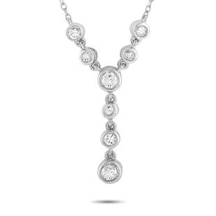 14K White Gold 0.25 ct Diamond Necklace: This necklace is crafted from 14K white gold and weighs 2.2 g. It is presented with a 15 chain and a pendant that measures 0.62 in length and 0.12 in width. The necklace is embellished with diamonds