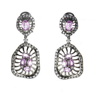 18K WG Diamond and Pink Sapphire Drop Earrings: This pair of drop earrings are colorful and unique. They are made of black rhodium dipped 18K white gold and boast a design that features 2.59ct of pink sapphires and 1.09ct of diamonds.