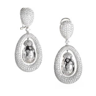 18K White Gold Diamond Dangle Earrings: This pair of earrings are lovely and unique. They are made of 18K white gold and are studded with 7.30ct of diamonds.