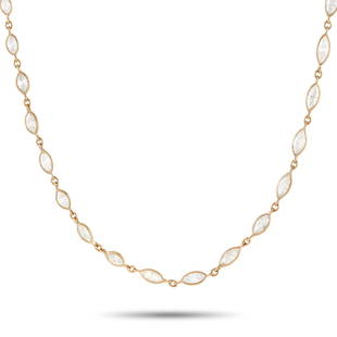 18K Yellow Gold 10.88 ct Diamond Necklace: This necklace is a simple, luxury piece that will shimmer and shine every time it catches the light. Accented by a series of marquise diamonds totaling 10.88 carats, it measures 27 long and features