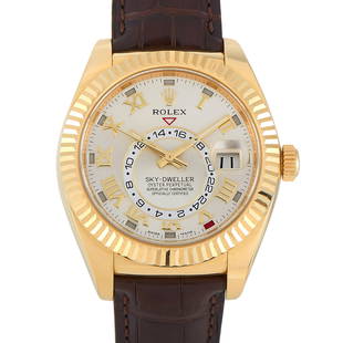 Rolex SkyDweller 18K Yellow Gold Watch 326138: This Rolex SkyDweller, reference number 326138, features an 18 K Yellow Gold case measuring 42 mm with an 18K Yellow Gold Fluted Command Bidirectional Bezel . It is presented on a brown alligator