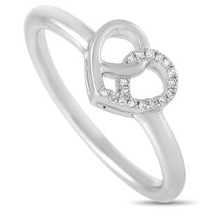 14K White Gold 0.05 ct Diamond Intertwined Heart Ring Size 6.75: This 14K White Gold 0.05 ct Diamond Intertwined Heart Ring is made with 14K White gold and features a heart shape set with 0.05 carats of roundcut diamonds around half of the heart. The ring has a