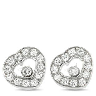 Chopard Happy Diamonds 18K White Gold 0.52 ct Diamond Earrings: These Chopard Happy Diamond earrings are sure to impress. Floating diamonds add extra movement to these impeccable heartshaped earrings, which measure 0.45 round. Crafted from 18K White Gold,