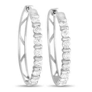 14K White Gold 1.02 ct Diamond Hoop Earrings: Intricate 14K White Gold metalwork pairs with roundcut diamonds totaling 1.02 carats on these impeccably designed luxury hoop earrings. They measure 1 long, making them the ideal size to make a