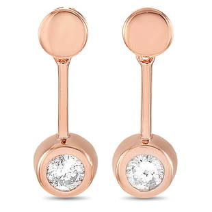 14K Rose Gold 0.58 ct Diamond Earrings: These earrings are made of 14K rose gold and embellished with diamonds that total 0.58 carats. The earrings measure 0.63 in length and 0.19 in width and each of the two weighs 1.45 grams.The pair is