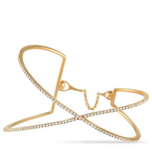 Messika 18K Rose Gold 1.55 ct Diamond Crossover Bangle Bracelet: This elegant Messika bracelet is the perfect understated accessory. The bracelet is made with a thin band of warm 18K rose gold, wrapping around the wrist and intersecting in the front. The bracelet