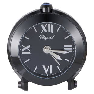 Chopard Happy Sport Alarm Clock 950200032: Creating a captivating sight by applying a stunning black PVD finish, Chopard present this outstanding alarm clock that boasts a fantastically dark appearance broken only by the striking contrast of