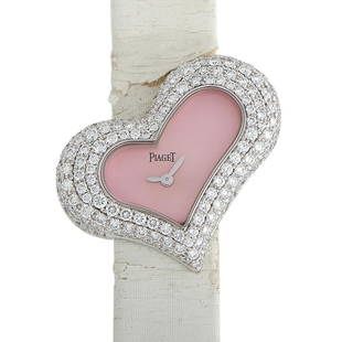 Piaget Limelight White Gold Diamond Heart Watch PI0257: This Piaget Lime light 18K White Gold Diamond Heart Watch comes with a white gold case with a diamondset bezel. The case is presented on a white leather strap. The soft pink dial displays hours and