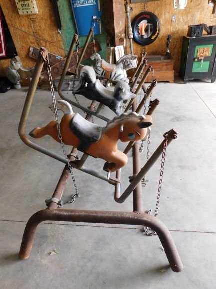 vintage cast alumnium swing set: vintage cast aluminum made with the same animals used for the spring ride swing set toys zebra, horse, skunk with chains, hardware top piece missing steel post paint loss on animals rust on top rack