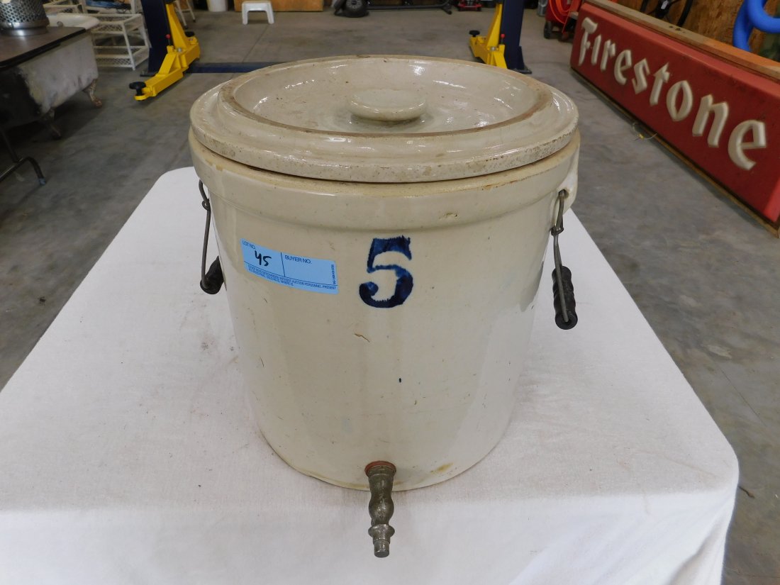 5 Gallon Crock with Lid and Spigot: 5 Gallon Crock with lid and spigot. Crock has 2 metal and wood handles, metal push button spigot, minor crack on backside, hairline crack on lid