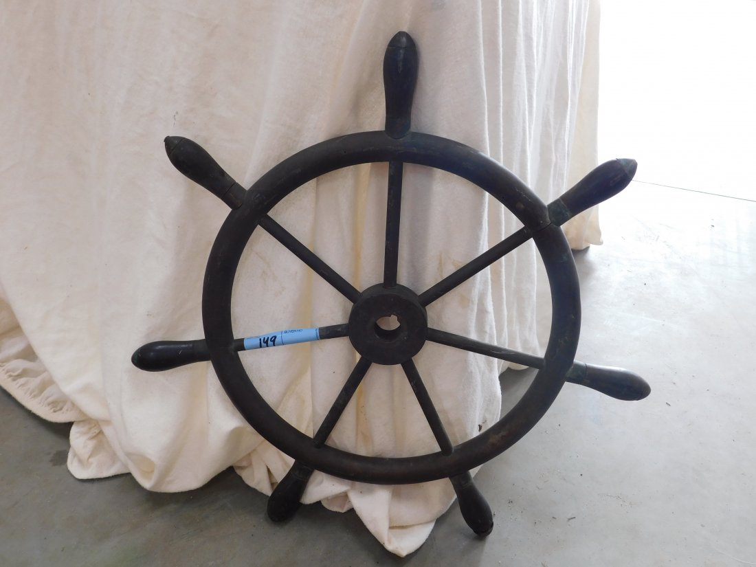 Brass Ship's Wheel: Brass ship's wheel, measures overall 24 inches in diameter, brass with wooden handles, (7) handles, has 1 1/8 inch hole in center, minor wear, good overall condition