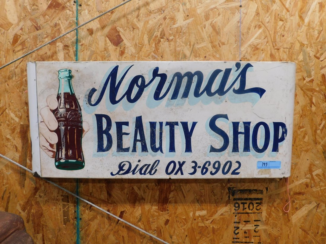 Coca-Cola Sled Sign: Tin Coca-Cola sled sign Norma's Beauty Shop Dual OX-3-6902. 2 inches by 16 inches by 2 1/2 inches, tin porcelain sign, one end has some damage to porcelain minor surface rust, minor scratches, display