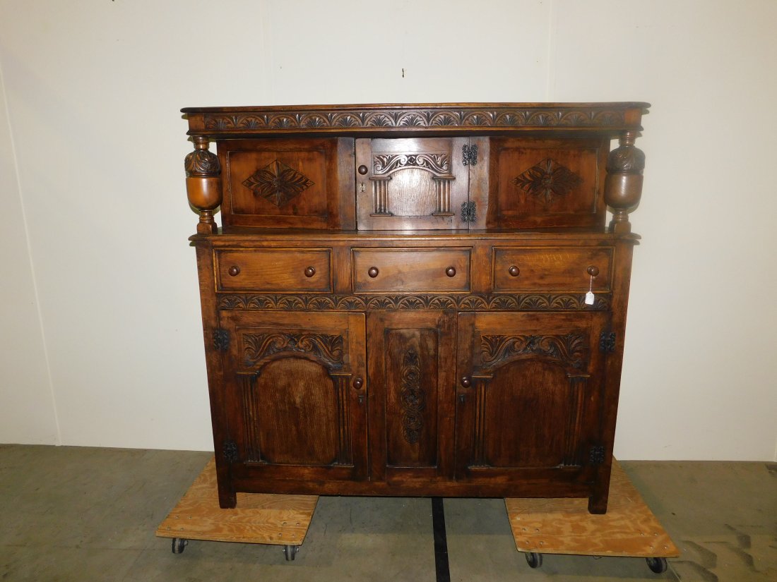ornate buffet/server: beautiful ornate buffet/server wonderful carvings one door on top three drawers and two doors on bottom approx. 61" wide 59 1/2" tall 20" deep excellent condition see pictures