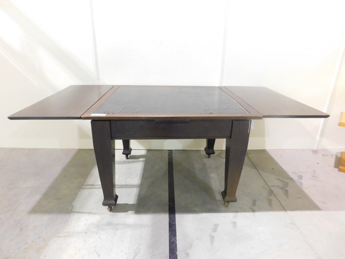 pub table: 4 legged pub table with dark finish on wheels approx. 75" long 38" wide 29" tall shows some wear overall fair condition see pictures