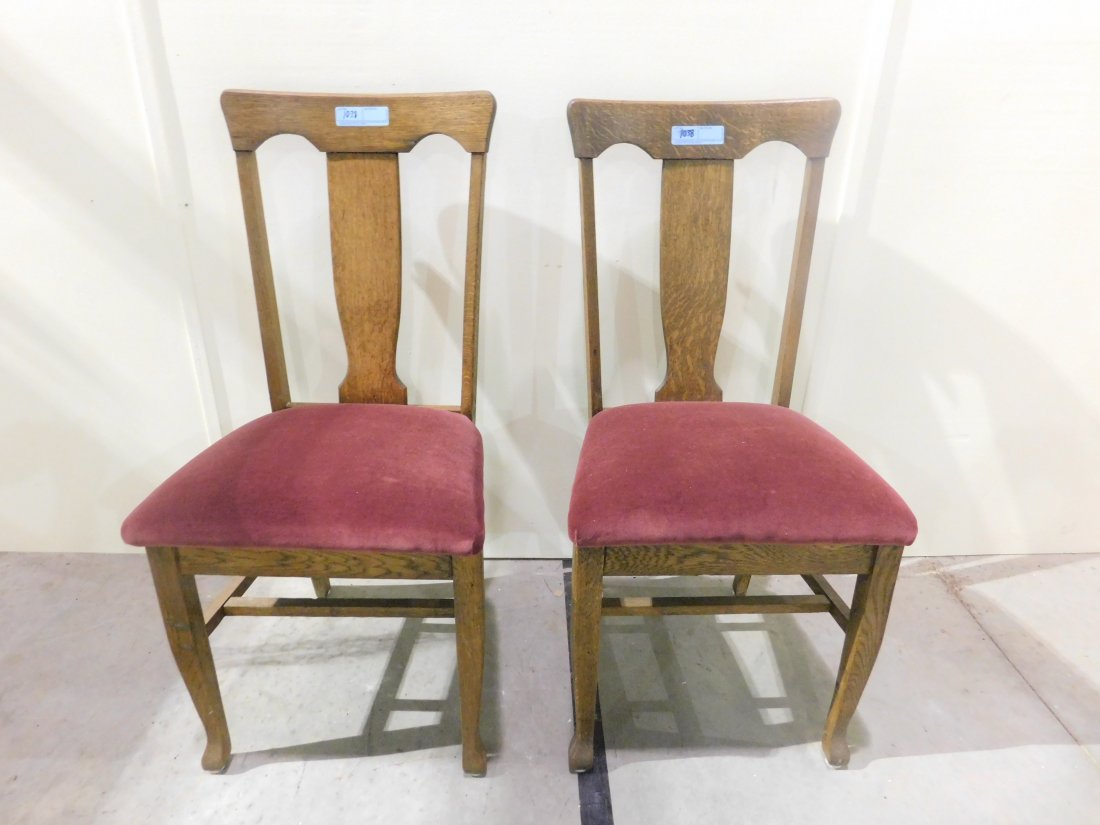 (2) oak dining room chairs: a pair of oak dining room chairs with burgundy padded seats 20" seat height overall very good condition