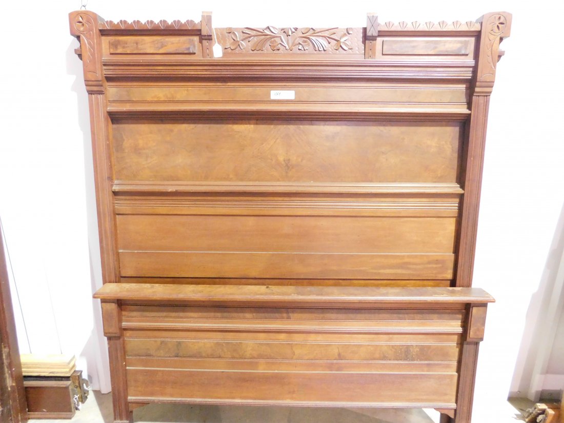 Wooden Full Size Bed: Wooden full size bed, includes headboard, footboard and side rails. Headboard is approx. 57 inches wide, 68 inches tall. Footboard is approx. 29 inches tall. Headboard top center is broken off. Shows