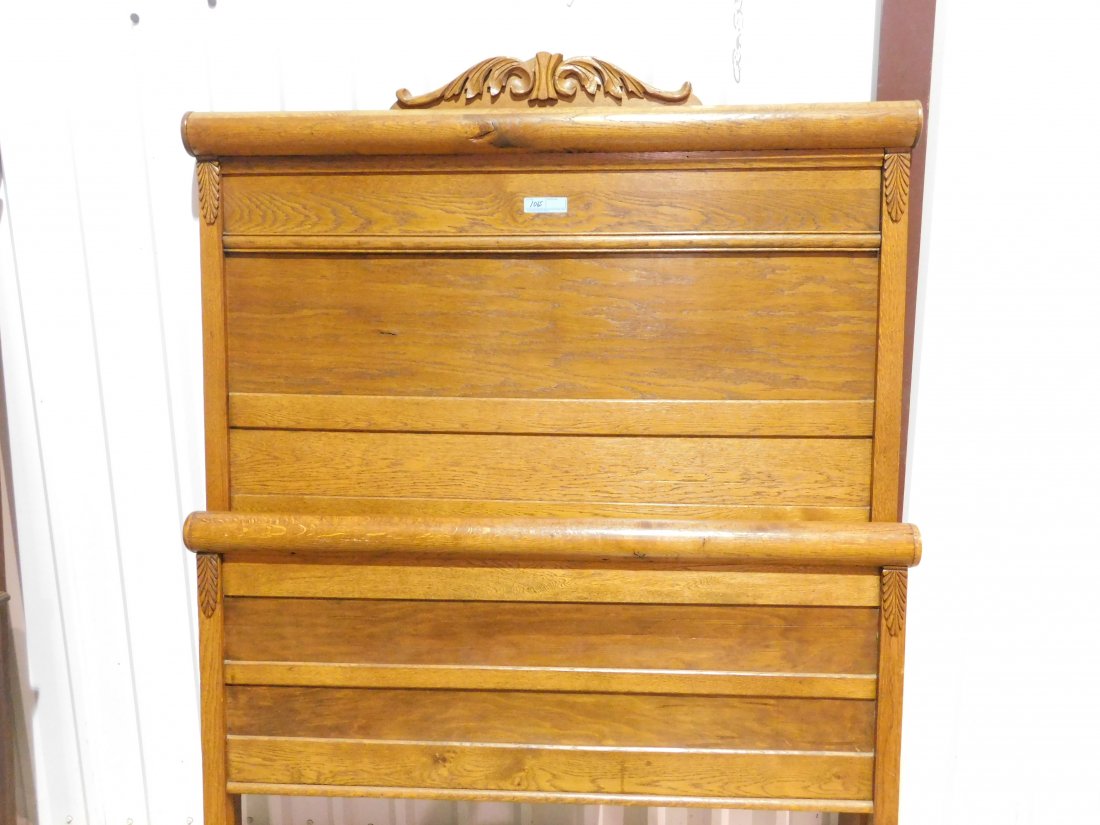 Oak Full Size Bed: Oak full size bed, includes headboard, footboard and side rails. Headboard is approx. 57 inches wide, 72 1/2 inches tall. Footboard is approx. 36 inches tall. Fancy scrollwork. Overall very good condi