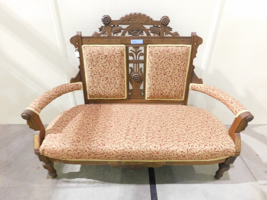 Eastlake Settee: Eastlake settee with cushion seat and back in muave/gold floral design. Approx. 60 inches wide. Overall very good condition.