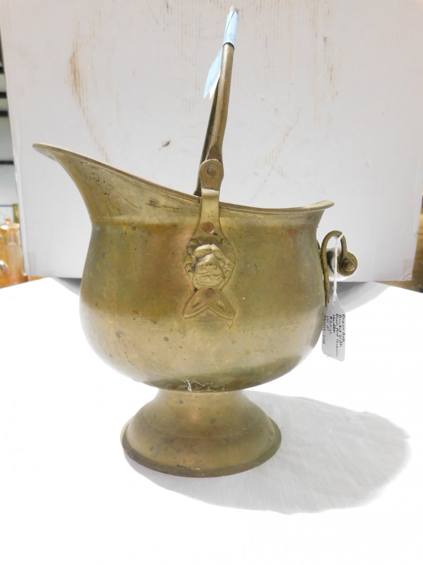 small brass ash bucket: very nice and heavy, brass ash bucket with brass and ceramic handles. Lions heads on sides. Approx. 8 1/2" tall(plus handle) 9" long 8" wide, Excellent condition