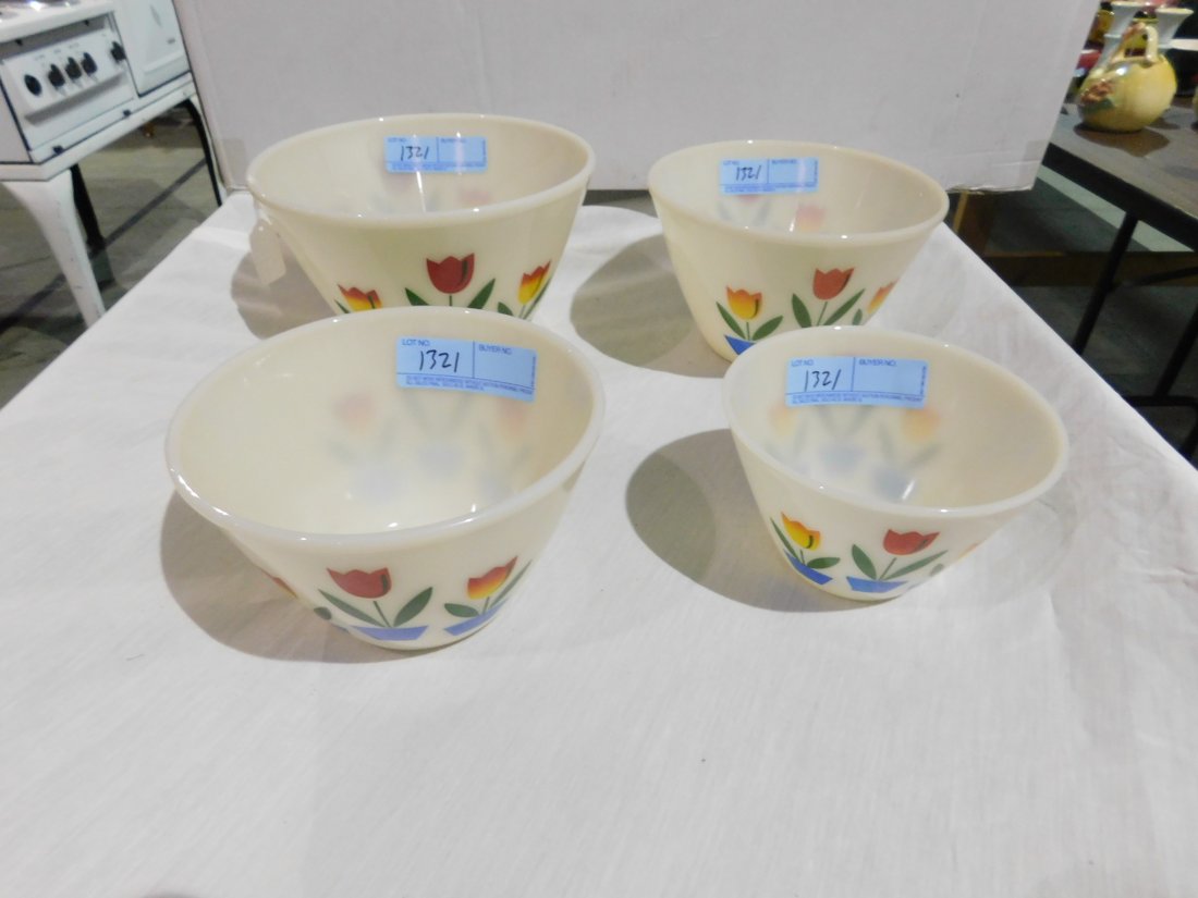 Set of Four Fire King Tulip Mixing Bowls: Set of four Fire King tulip pattern nesting mixing bowls. Approx. 6 inch, 7 inch, 8 inch, and 9 inch diameters. Very good condition, no chips or cracks.