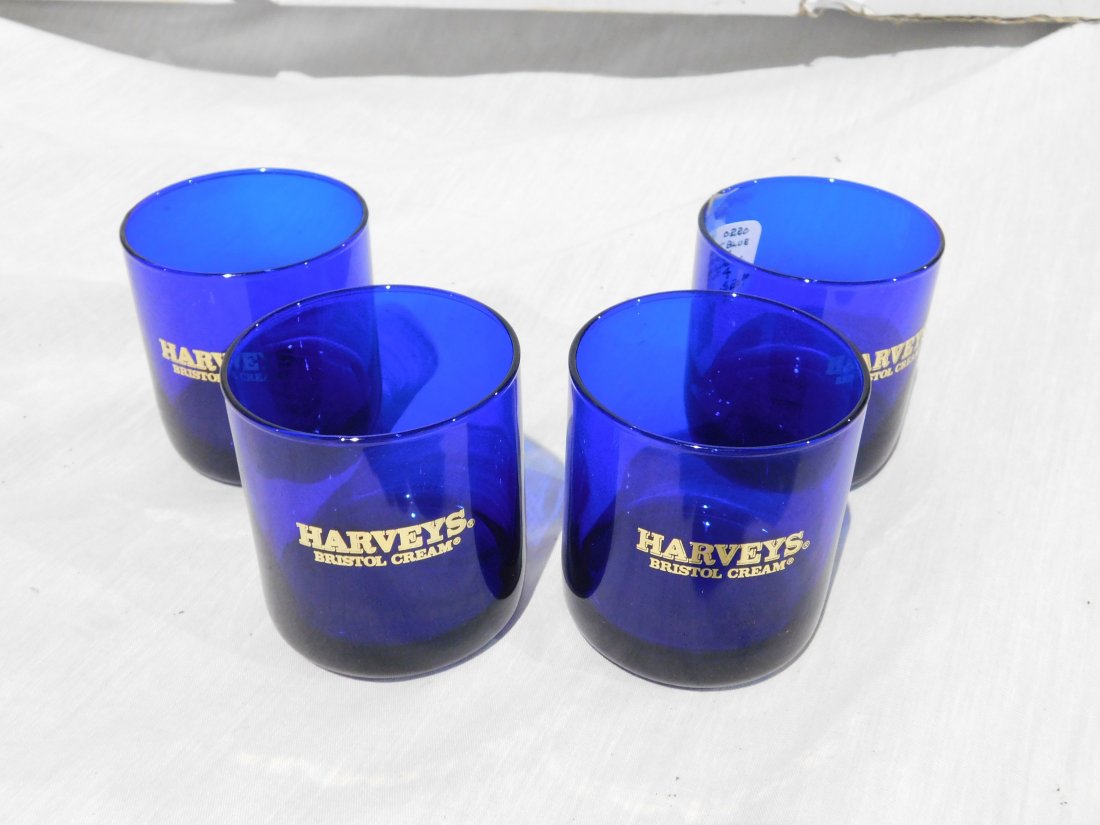 4 Cobalt Blue Drinking Glasses (Harveys Bristol Cream): Set of 4 cobalt blue glass drinking glasses with "HARVEYS BRISTOL CREAM" in gold. Very good condition, no chips or cracks.