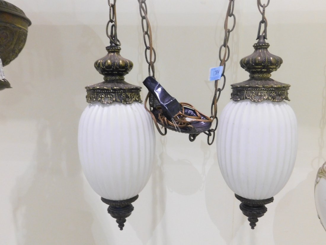 Vintage Double Hanging Lamps: Vintage double hanging electric lamps, brass and white glass. Ornate design. Complete, overall good condition.