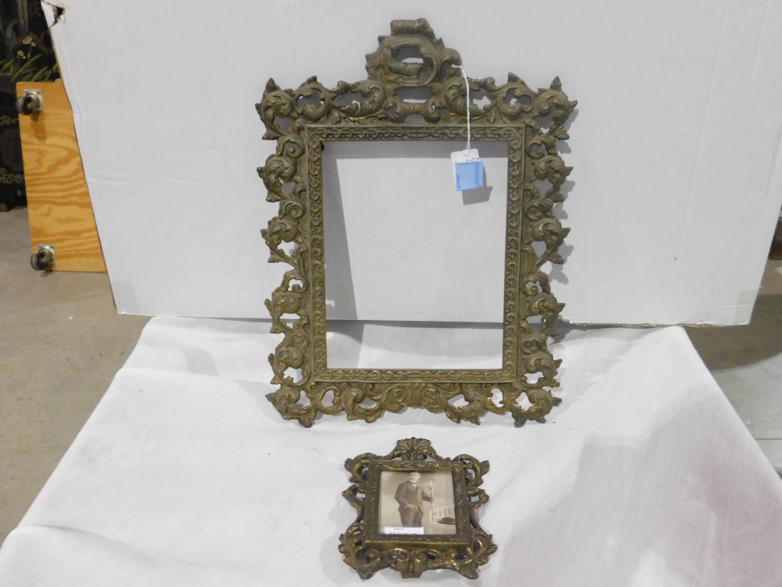 Pair of Cast Iron Picture Frames: Pair of vintage, ornate cast iron picture frames. One is 8 x 10 (no glass), other is 3 1/2 x 4 1/2 (has glass). Overall good condition.