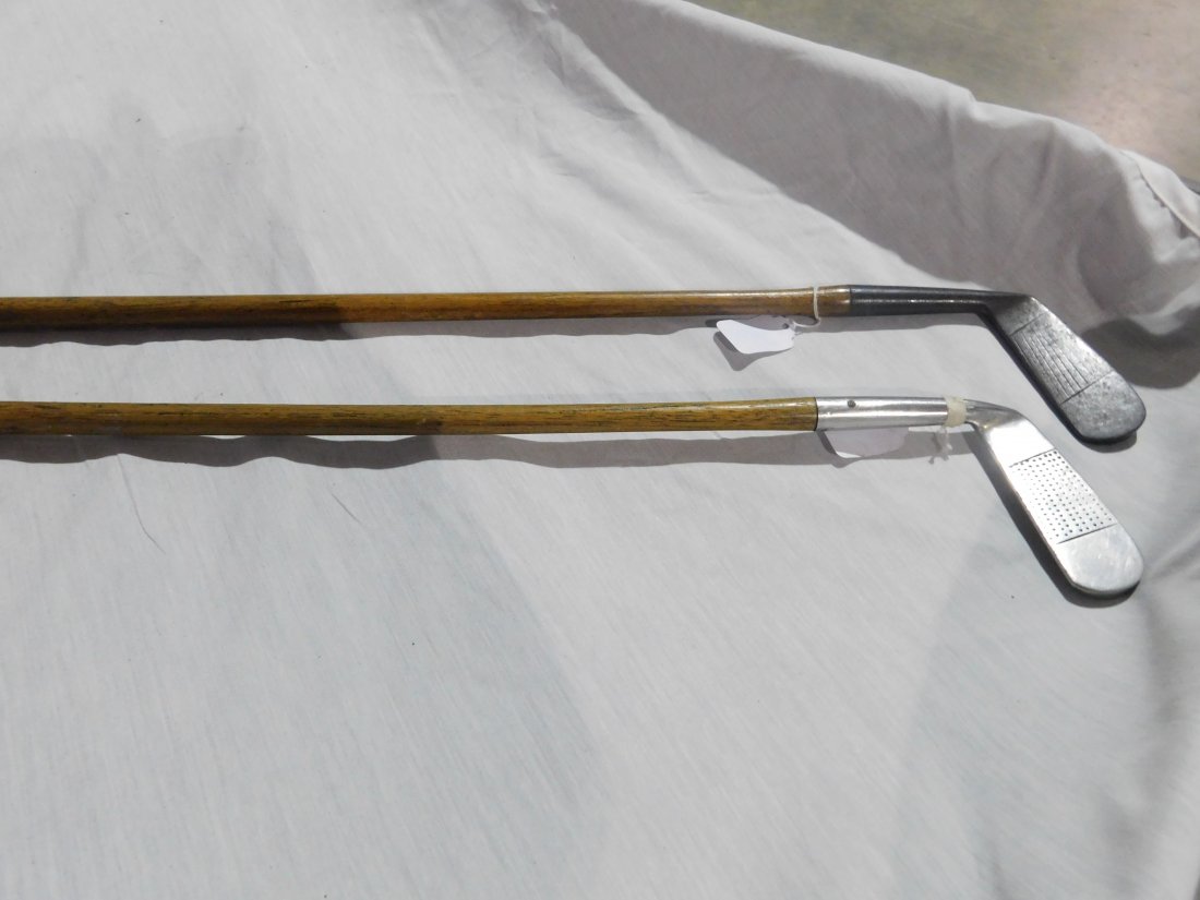 2 Vintage Golf Clubs: Two vintage golf clubs. One is a Jos. Anderson wood shaft putter; the other is a wood shaft putter made in Scotland. General wear, overall good condition.