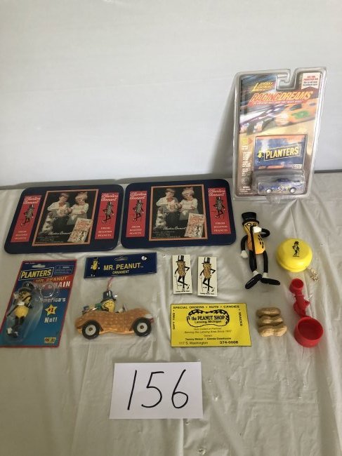 12 piece planters peanuts advertising lot: lot consisting of: 2 tin trivets, 1 Johnny Lightning die cast race car, 1 key chain, 1 ornament, 3 magnets, 1 Mr. Peanut bendable figure, 1 red measuring spoon, 1 rubber peanuts, and 1 yellow yo-yo pl