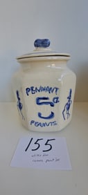 white and blue ceramic peanut jar