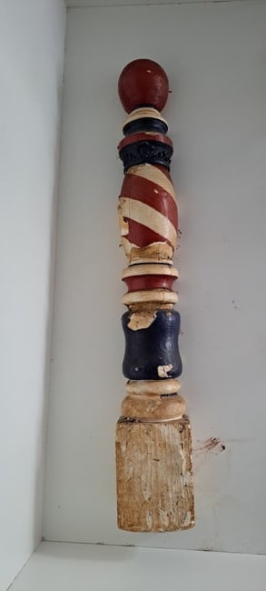 Early plaster barber pole sign (1 of 7)