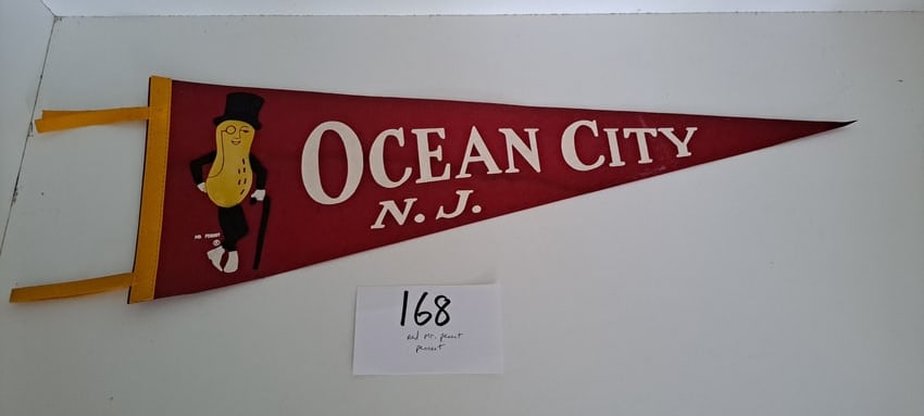 Mr. Peanut Ocean City felt pennant: hard to find, red, Mr. Peanut, Ocean City N.J., advertising, felt pennant, 2 small holes from thumb tacs, otherwise very good condition, approx. 27" long, please verify auction location for pick up