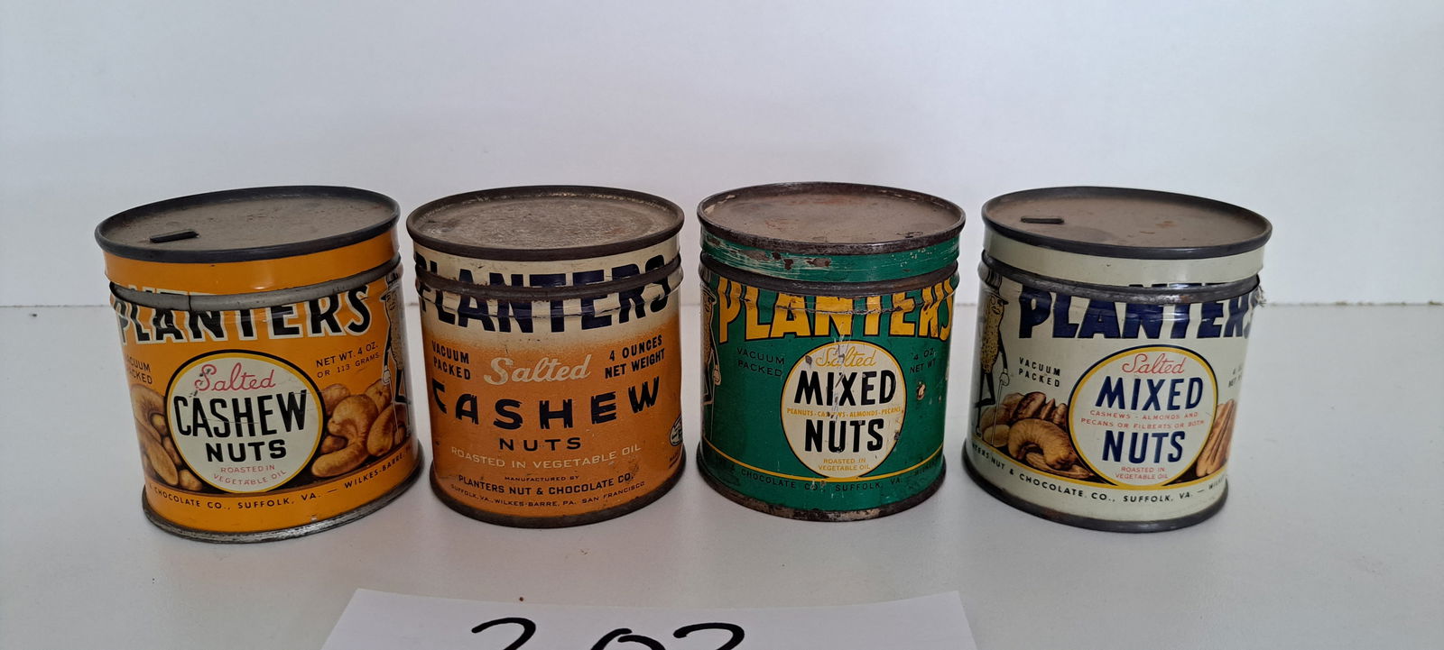 (4) Planters Peanut 4oz. cans: group of 4 Planters Peanut 4 oz. cans, 2 different cashew tins, 2 different mixed nuts tins, each opened, with correct lids, each have wear, each approx. 2.75" tall, please verify auction location for