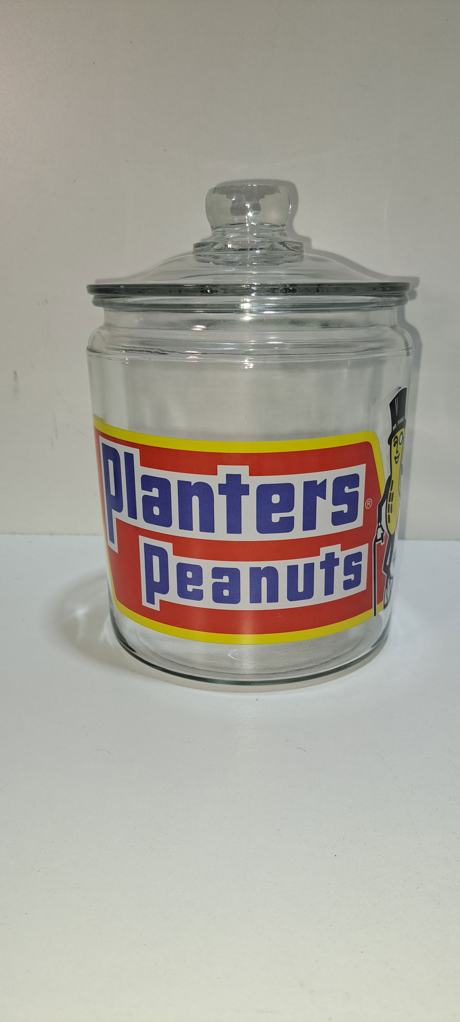 Planters Peanuts glass counter jar: small Planters Peanuts, glass, counter jar with Mr. Peanut, correct lid, approx. 5.75" diameter, 8" tall, excellent condition, no chips or cracks, Please note: if picking up, location is different