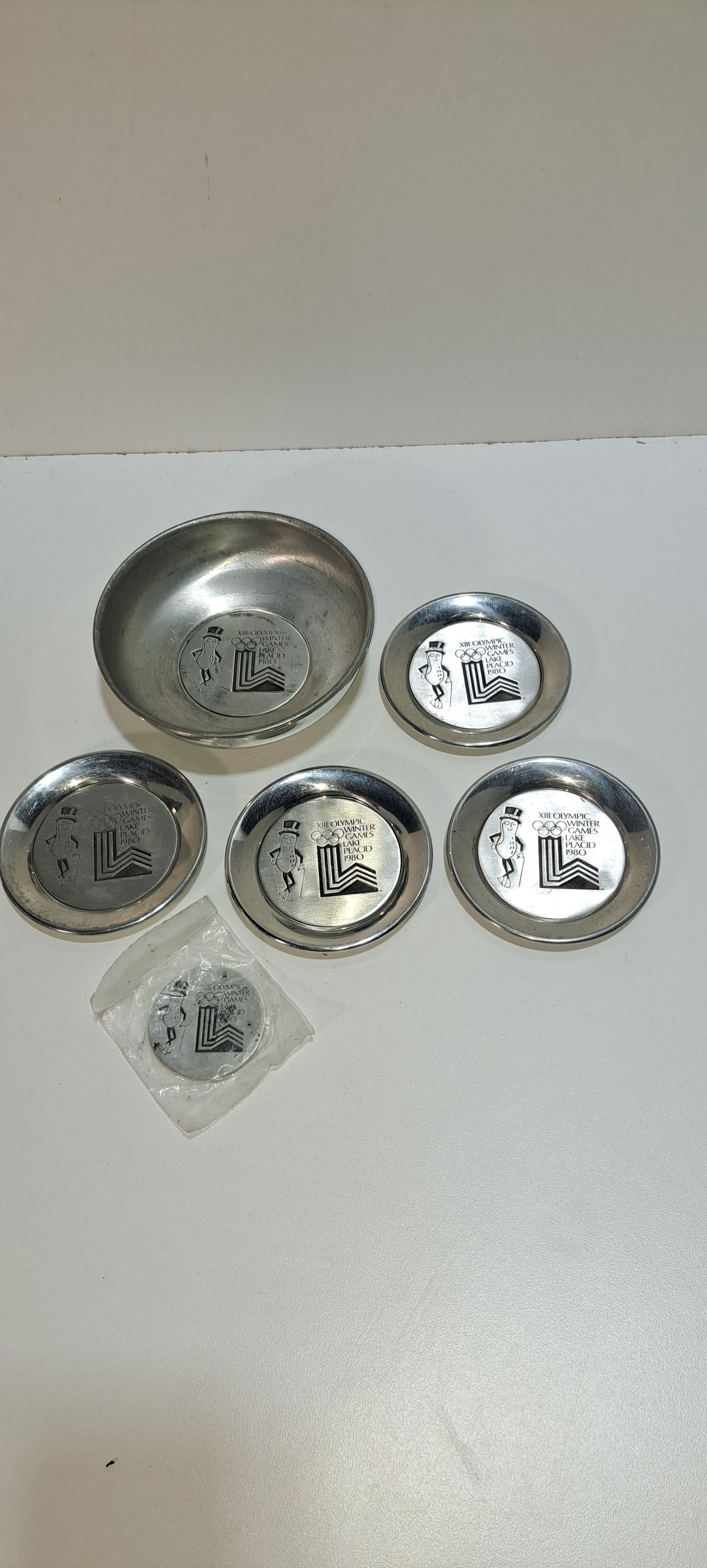 1980 Olympic Mr. Peanut set: 1980 Olympic Winter Games, Lake Placid, Mr. Peanut bowl and coin set, 1 bowl, 4 coasters, 1 coin, minor wear, coin still in plastic, Please note: if picking up, location is different than auction