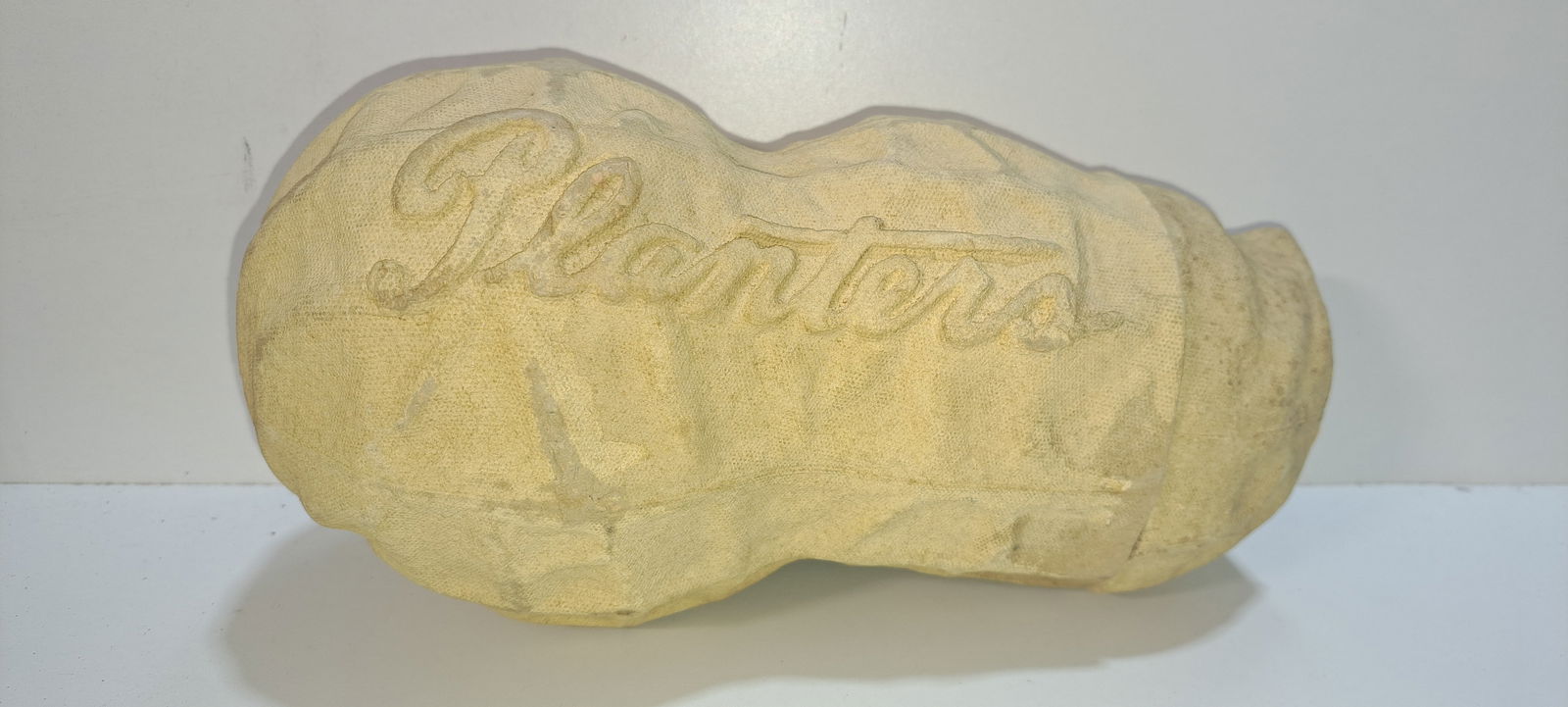 Planters paper mache peanut container: paper mache, peanut shaped container, held 1 lb. of peanuts, embossed PLANTERS, with souvenir sticker from Norfolk Virginia, shows minor wear, approx. 10" long, Please note: if picking up, location