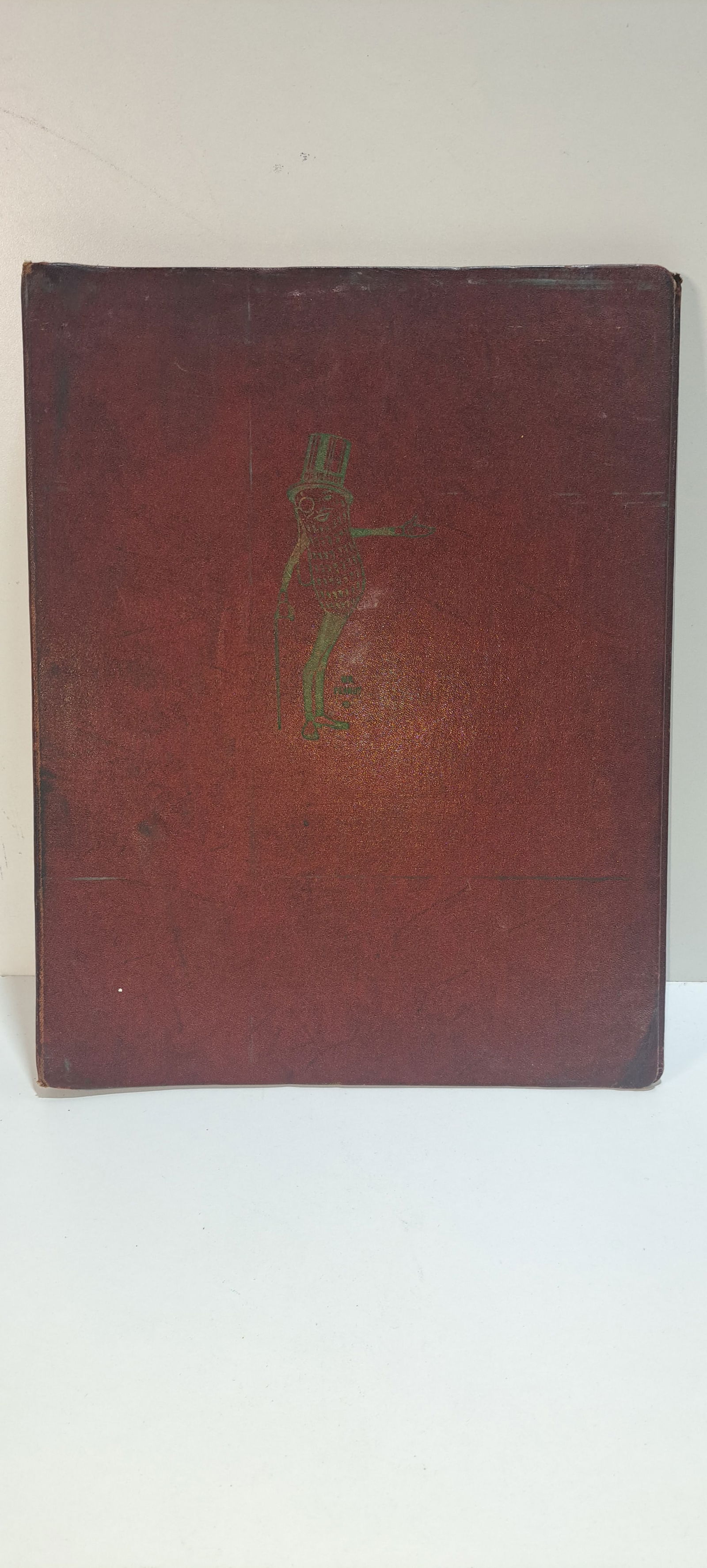 Mr. Peanut advertising binder: early and unusual binder for Planters Peanut advertising material, great image of Mr. Peanut in gold on front cover, has wear as shown but a very uncommon piece, approx. 12" x 15", Please note: if