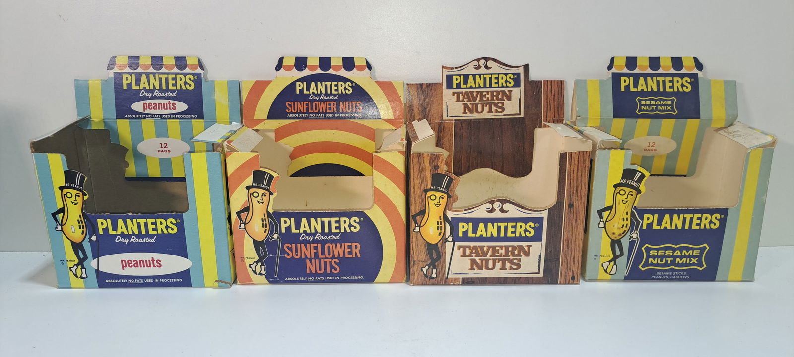 (4) Planters Peanuts display boxes: lot of 4 different Planters Peanuts, die-cut, cardboard display boxes, all with Mr. Peanut, all Standard Brands era, all show minor wear, each approx. 6.5" x 6" x 3.5", Please note: if picking up, loc