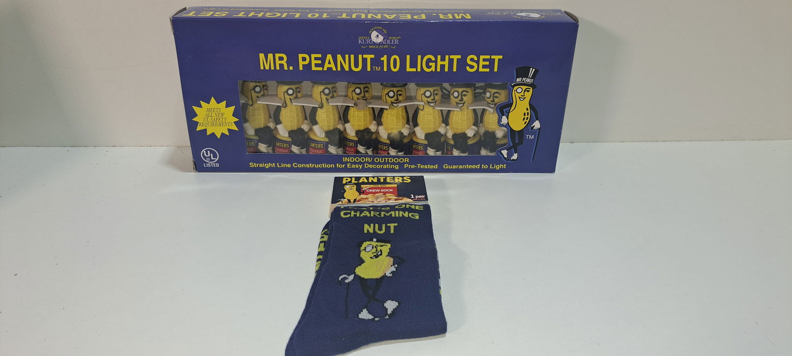 Mr. Peanut light set and socks: lot consisting of: new in box Mr. Peanut 10 light set, and new pair of Mr. Peanut crew socks, both in excellent unused condition, Please note: if picking up, location is different than auction