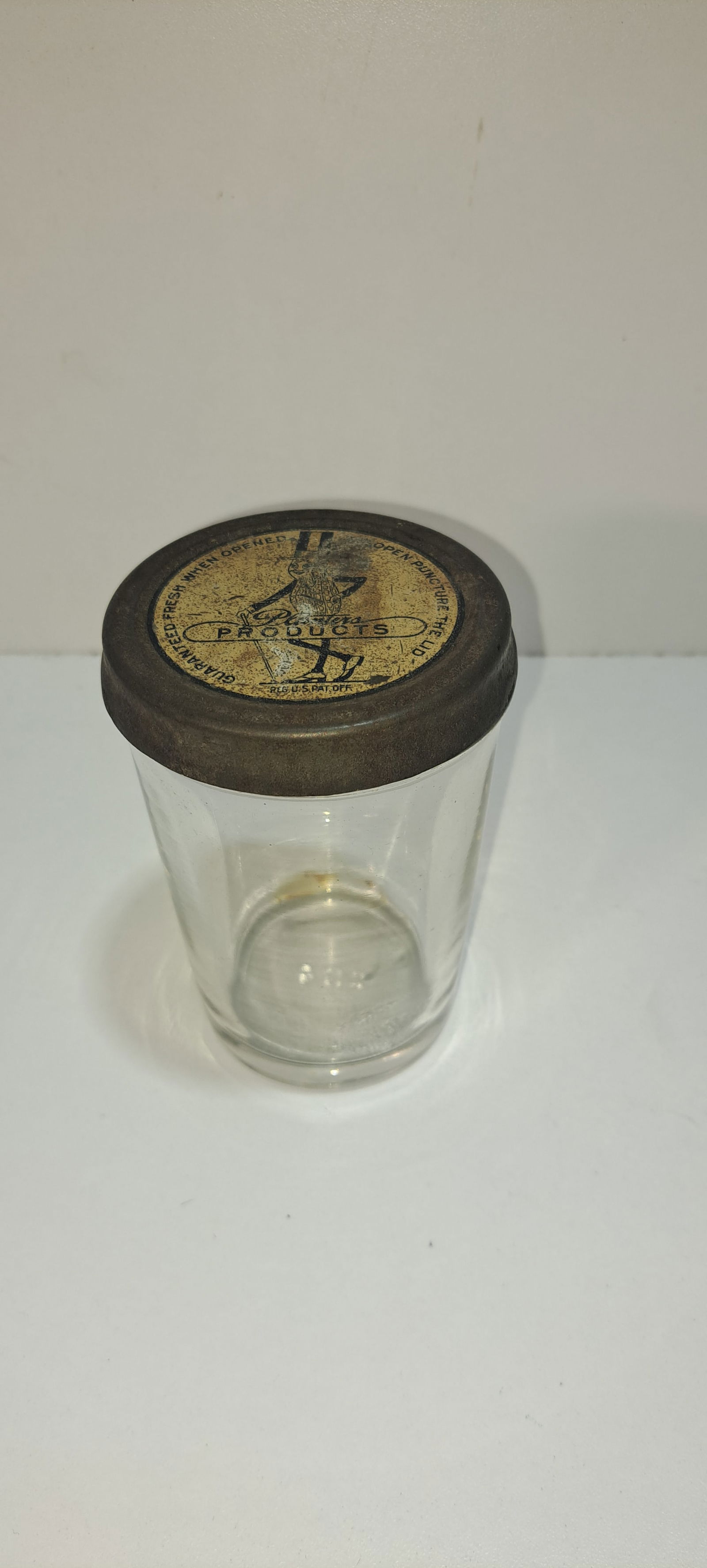 early Planters Peanuts peanut butter jar, tin lid: early, Planters Peanuts, peanut butter, glass jar with anodized tin lid, (1920's), jar has chips on edge, lid has wear as shown, approx. 4.5" tall, Please note: if picking up, location is different