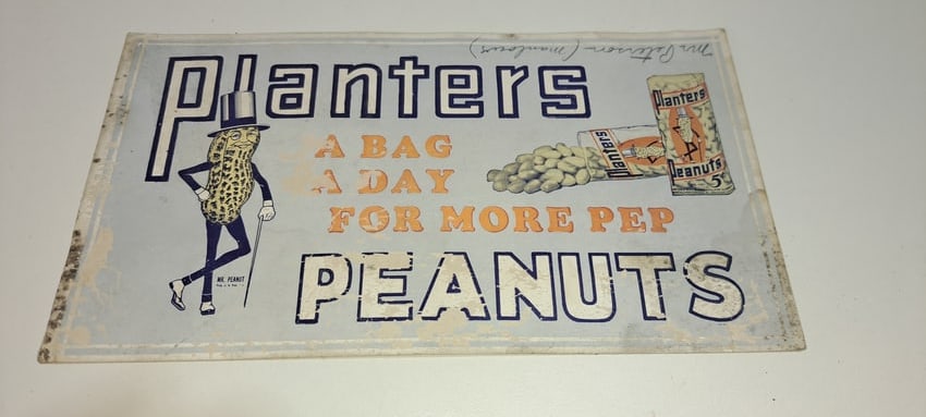 Planters Peanuts cardboard sign: Planters Peanuts "A bag a day for more pep", single sided sign, has wear as shown, writing in pencil at top, approx. 5.25" x 9.5", Please note: if picking up, location is different than auction locati