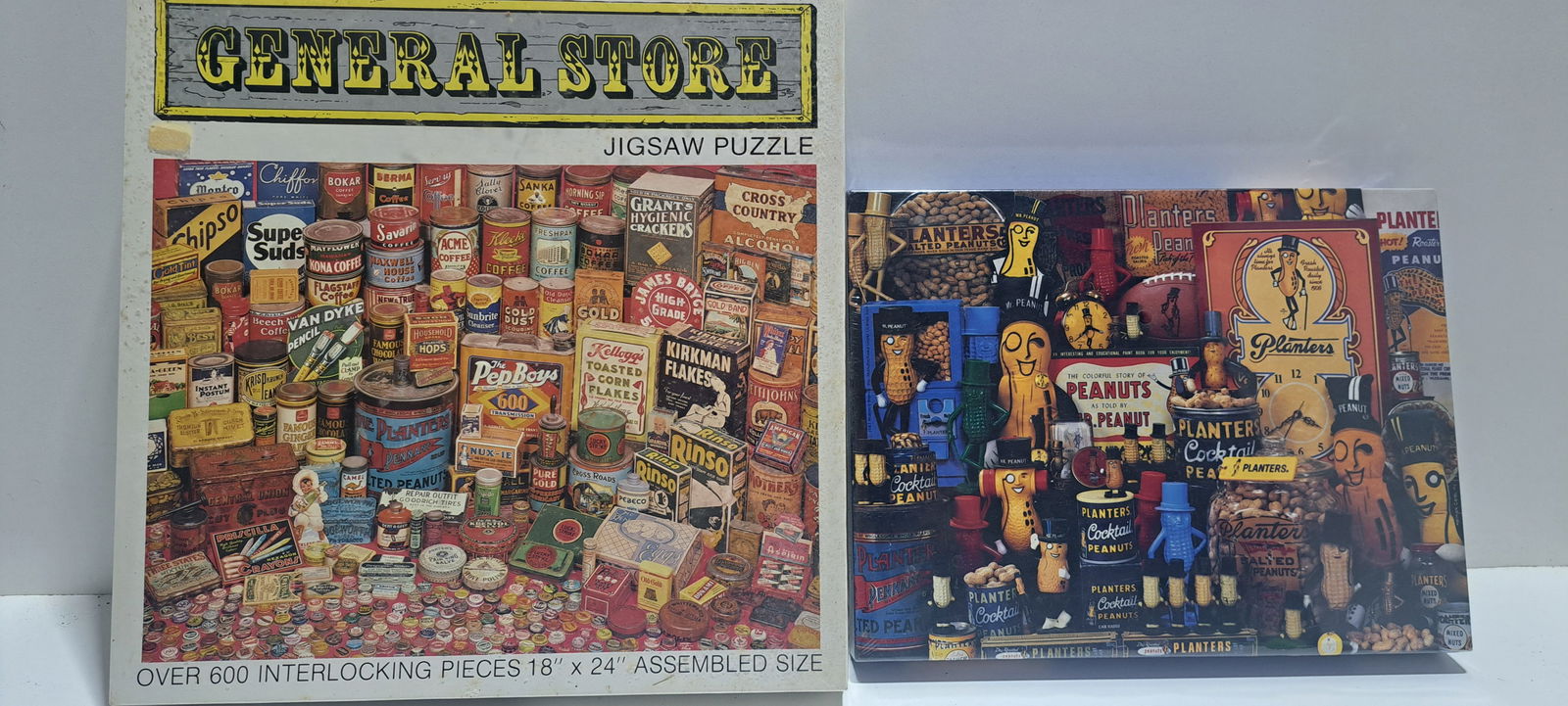 2 puzzles: 2 puzzles, new in box, sealed, 1 500 piece all Planters Peanuts collectibles, other 600 piece showing general store collectibles, good condition, Please note: if picking up, location is different than