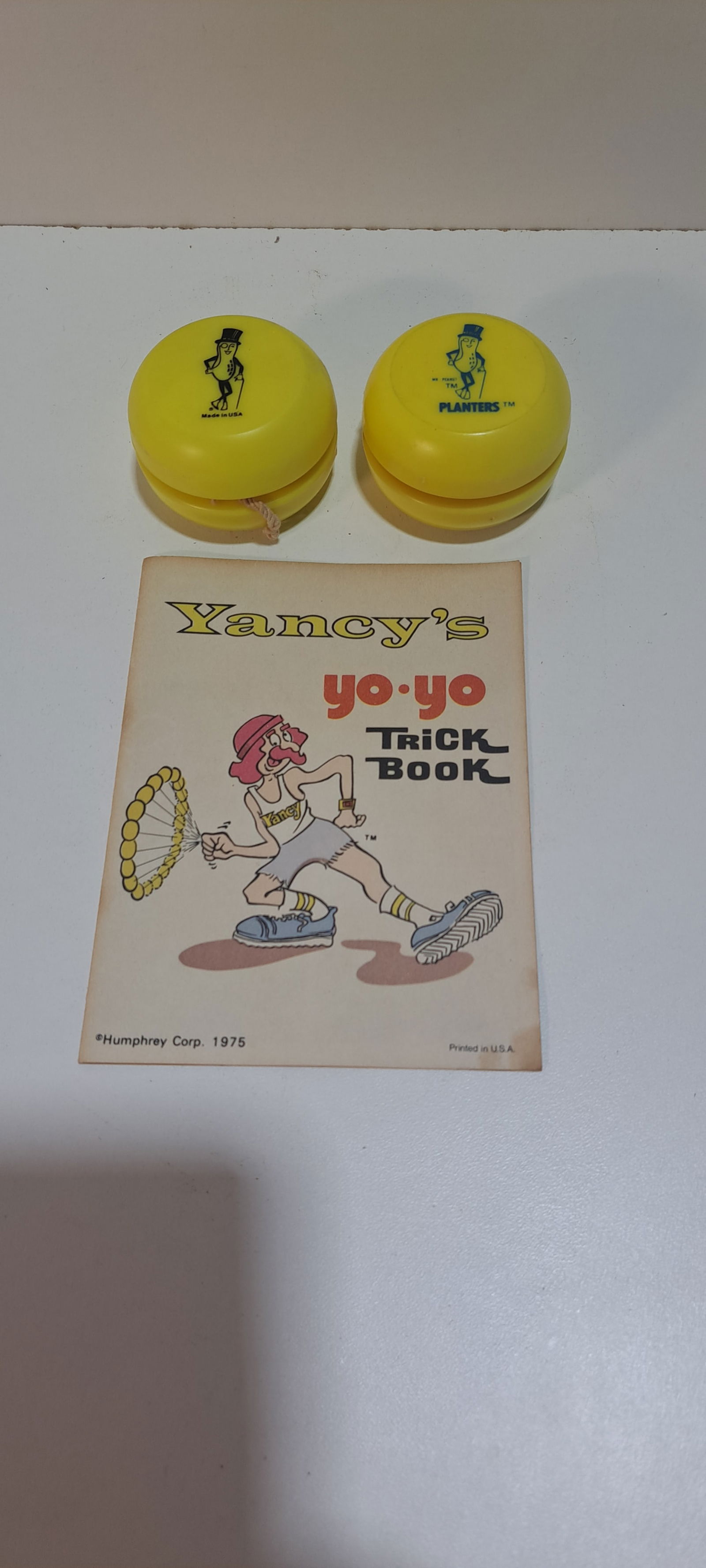 2 Mr. Peanut yo-yo's: 2 different variations of Mr. Peanut yo-yo's, with instruction booklet, good condition, minor wear, each approx. 2.25" diameter, Please note: if picking up, location is different than auction