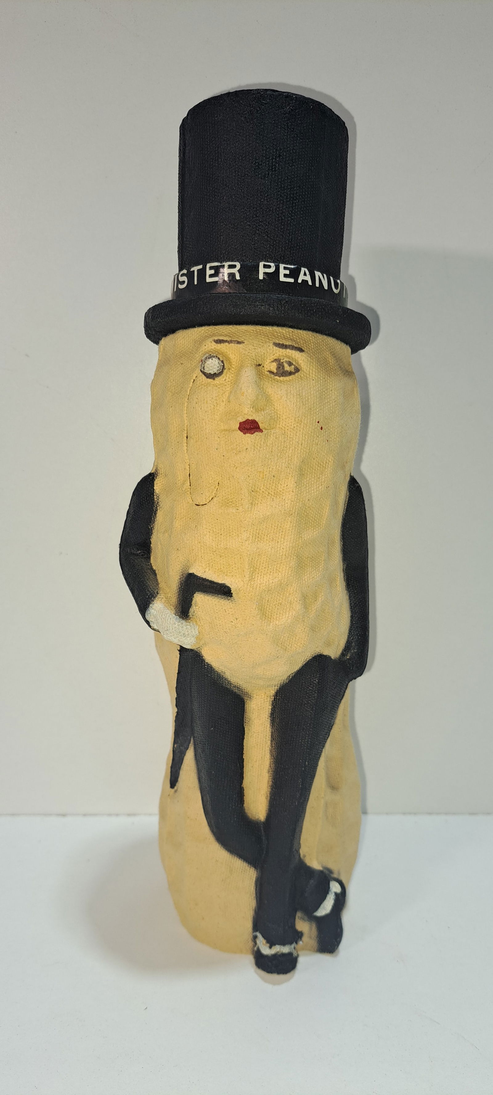 paper mache Mr. Peanut container: early paper mache, figural, Mr. Peanut with removeable hat, held 1/2 lb. of peanuts, tip of foot missing, which is common, otherwise good condition, approx. 12.5" tall, Please note: if picking up, loc