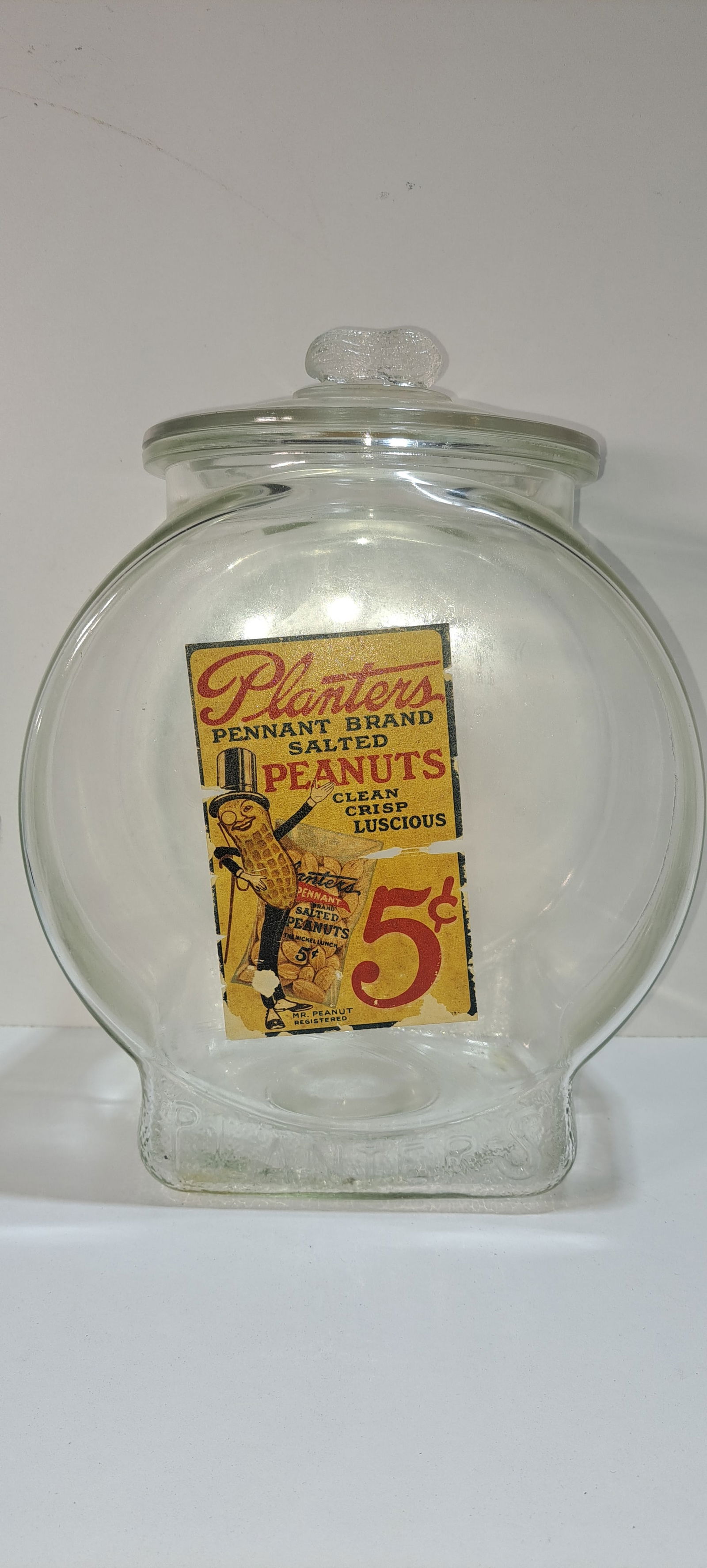 Planters Peanuts fishbowl jar: large Planters Peanuts fishbowl, glass counter top jar with decal, correct lid with peanut shaped handle, few minor chips on lip of jar and lid, some damage to label as shown, approx. 13" tall, Please